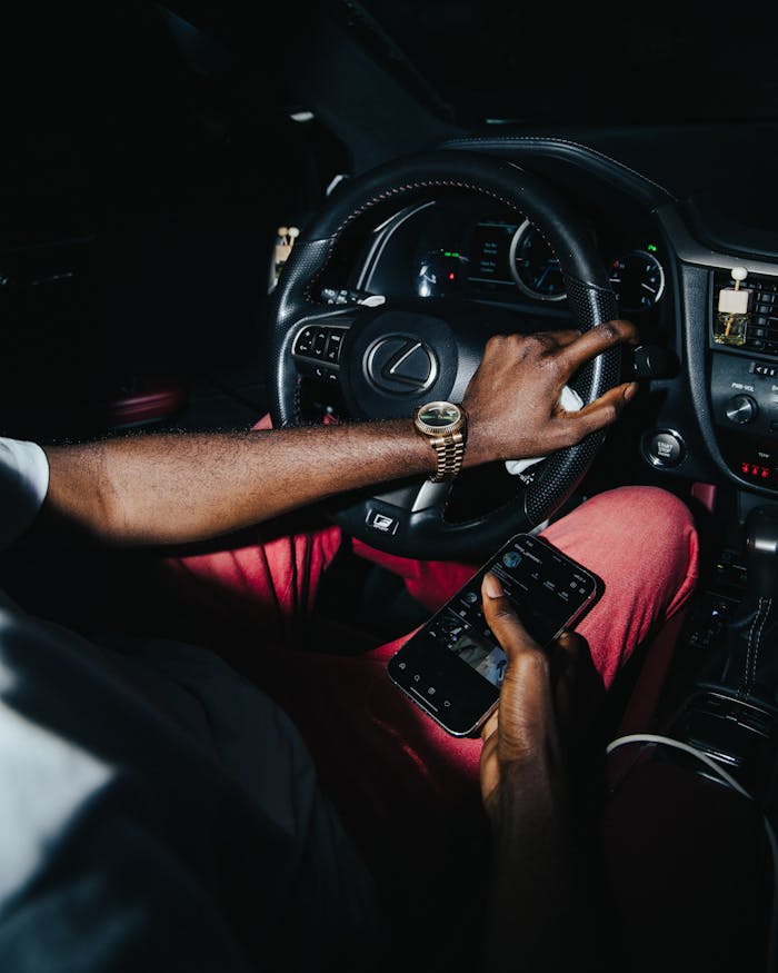 Man Sitting in a New Lexus Car